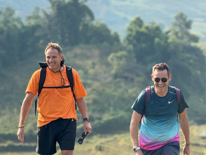 Two men hiking the vietnamese trails on tour with Adam Donovan from authentic adventures.